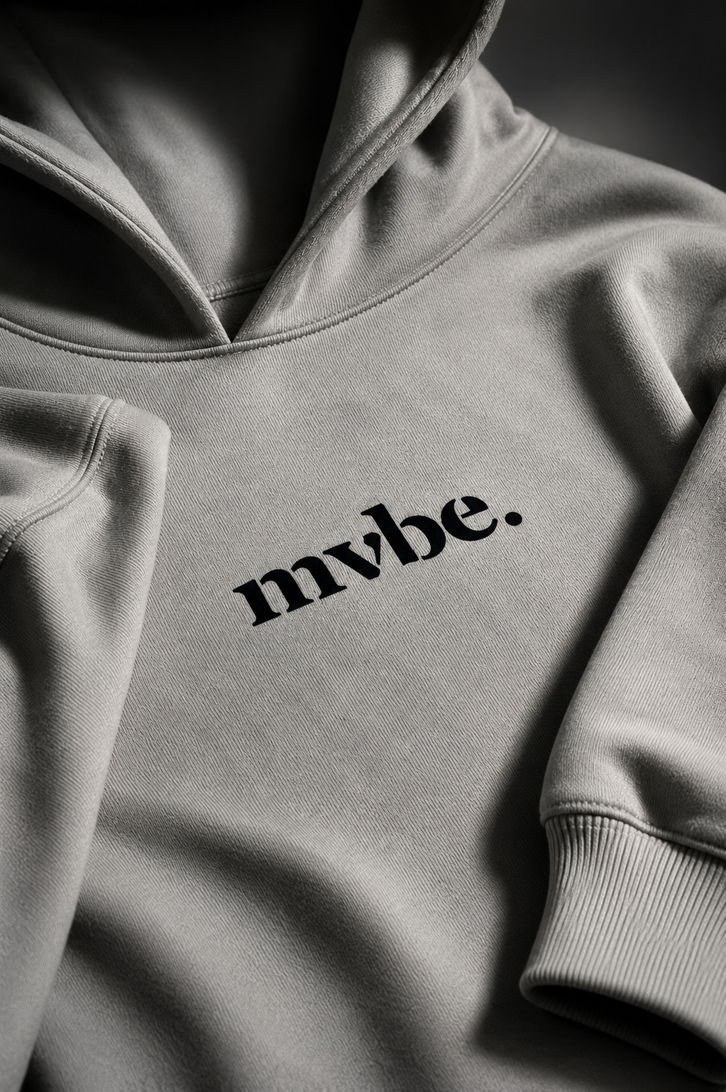 Person wearing a beige hoodie with a logo on the back against a white background
Man wearing a beige oversized hoodie with 'mvbe' logo against a plain background. ribbed sleeves and hem. warm oversized hoodie, these are uni-sex unisex products. The hoodie has aussie, aussie, aussie logo. logo says aussie aussie aussie. australian aussie hoodie