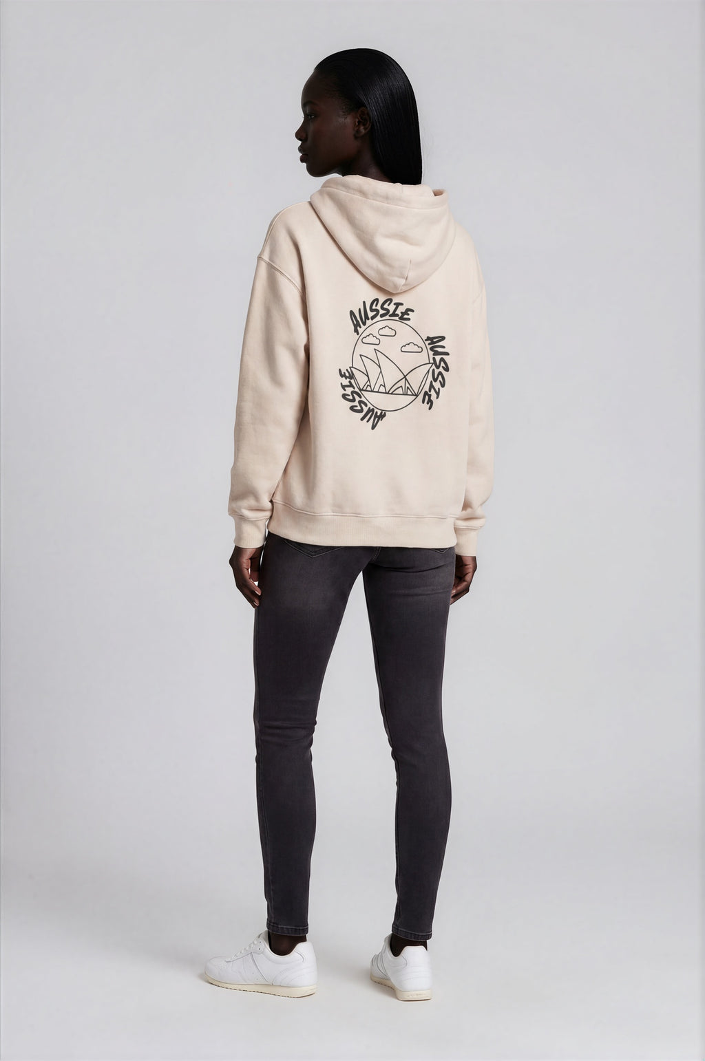 Person wearing a beige hoodie with a logo on the back against a white background
Man wearing a beige oversized hoodie with 'mvbe' logo against a plain background. ribbed sleeves and hem. warm oversized hoodie, these are uni-sex unisex products. The hoodie has aussie, aussie, aussie logo. logo says aussie aussie aussie. australian aussie hoodie