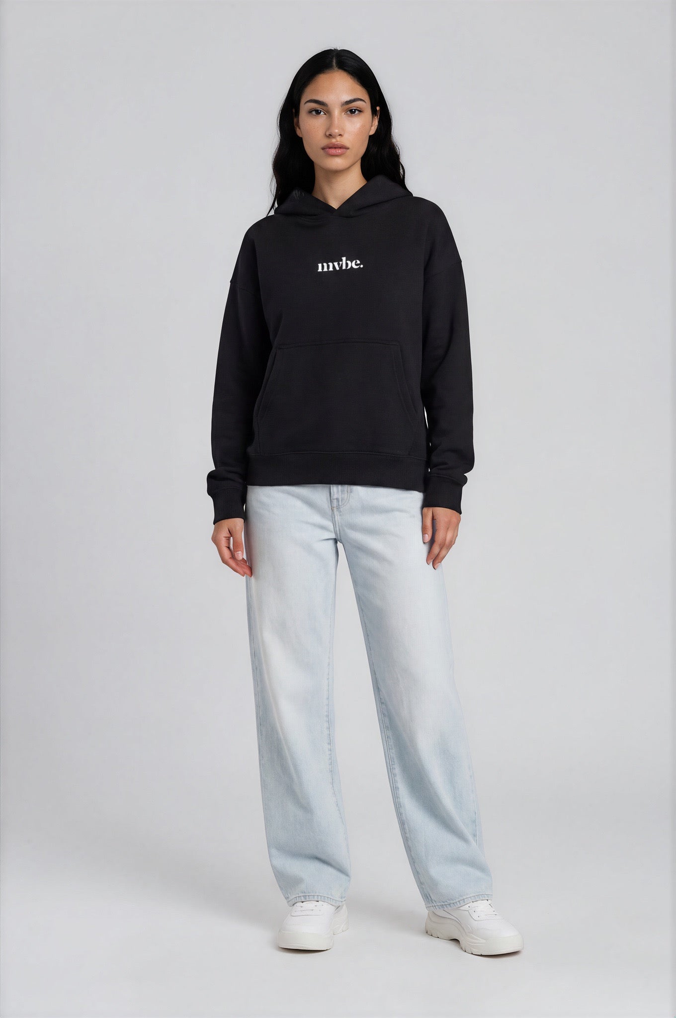 Person wearing a black hoodie with a design pattern on the back against a white background
Man wearing a black oversized hoodie with 'mvbe' logo against a plain background. ribbed sleeves and hem. warm oversized hoodie, these are uni-sex unisex products. The hoodie has pakistani design on the back. it  says shayad in urdu on a hoodie. hoodie is having rug design. pakistani origin.