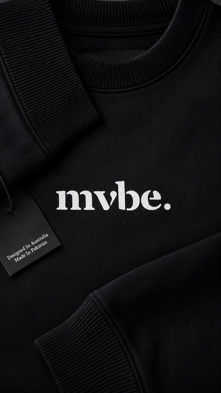 Person wearing a black sweatshirt with a design pattern on the back against a white background
Man wearing a black oversized sweatshirt with 'mvbe' logo against a plain background. ribbed neck, sleeves and hem. warm oversized hoodie, these are uni-sex unisex products. the design at back says mvbe, mvbe not. which is a signature sweatshirt for the brand. it is comfortable and a soft material sweat.