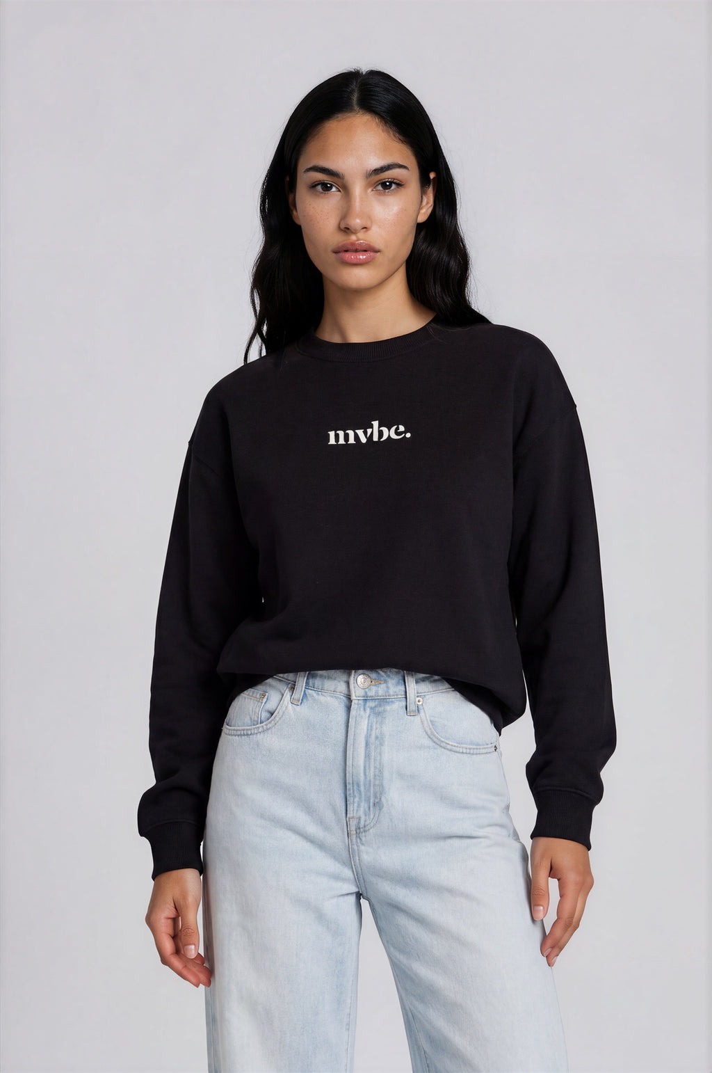 Person wearing a black sweatshirt with a design pattern on the back against a white background
Man wearing a black oversized sweatshirt with 'mvbe' logo against a plain background. ribbed neck, sleeves and hem. warm oversized hoodie, these are uni-sex unisex products. the design at back says mvbe, mvbe not. which is a signature sweatshirt for the brand. it is comfortable and a soft material sweat.