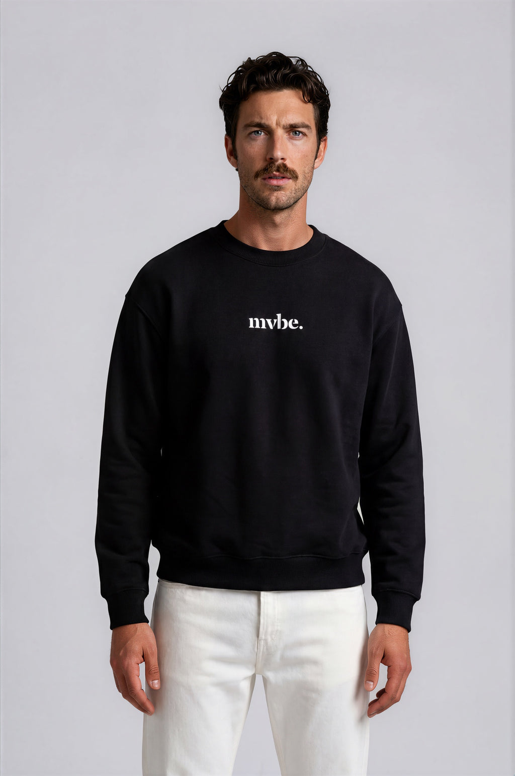 Person wearing a black sweatshirt with a design pattern on the back against a white background
Man wearing a black oversized sweatshirt with 'mvbe' logo against a plain background. ribbed neck, sleeves and hem. warm oversized hoodie, these are uni-sex unisex products. the design at back says mvbe, mvbe not. which is a signature sweatshirt for the brand. it is comfortable and a soft material sweat.