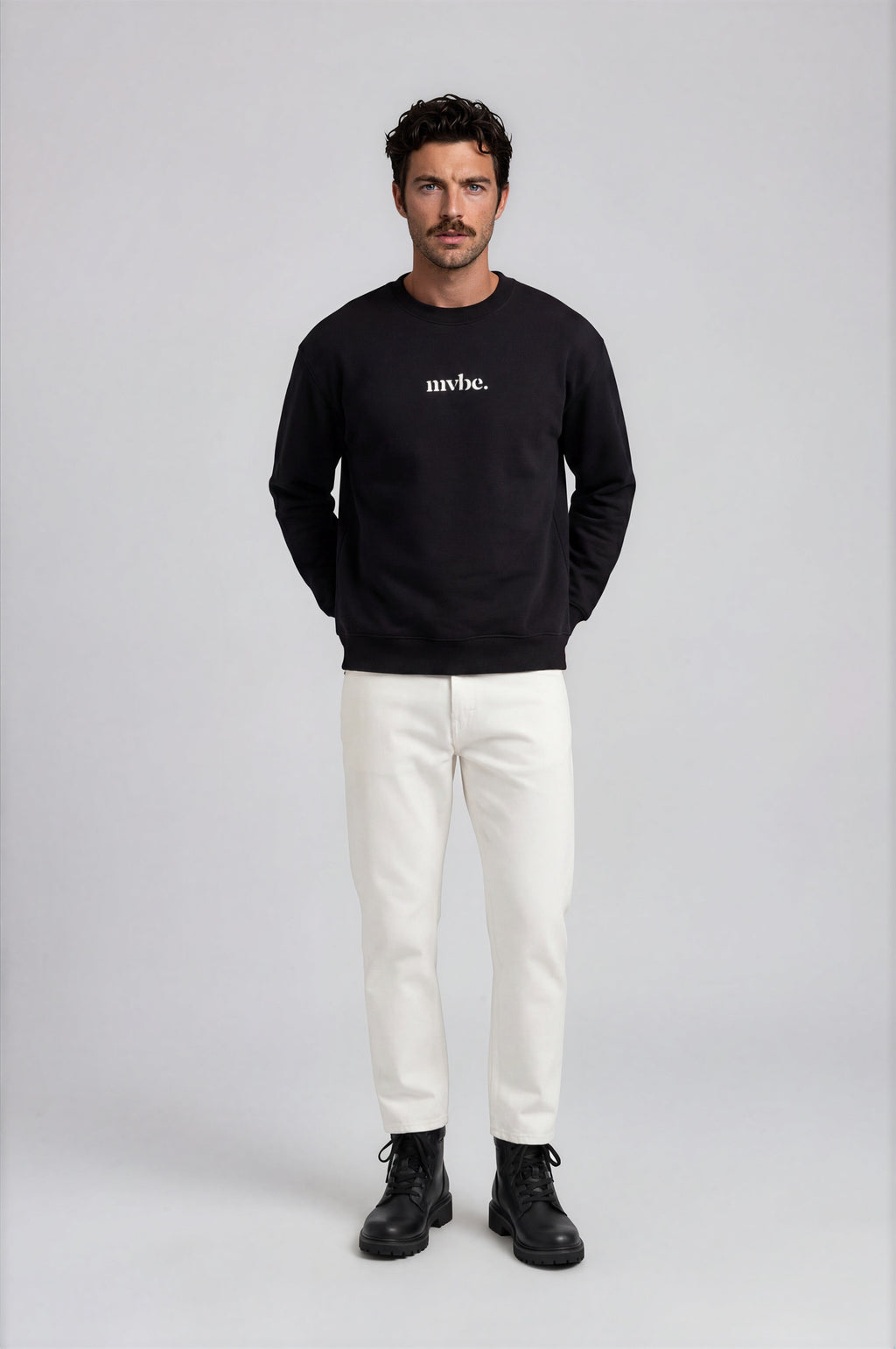 Person wearing a black sweatshirt with a design pattern on the back against a white background
Man wearing a black oversized sweatshirt with 'mvbe' logo against a plain background. ribbed neck, sleeves and hem. warm oversized hoodie, these are uni-sex unisex products. the design at back says mvbe, mvbe not. which is a signature sweatshirt for the brand. it is comfortable and a soft material sweat.